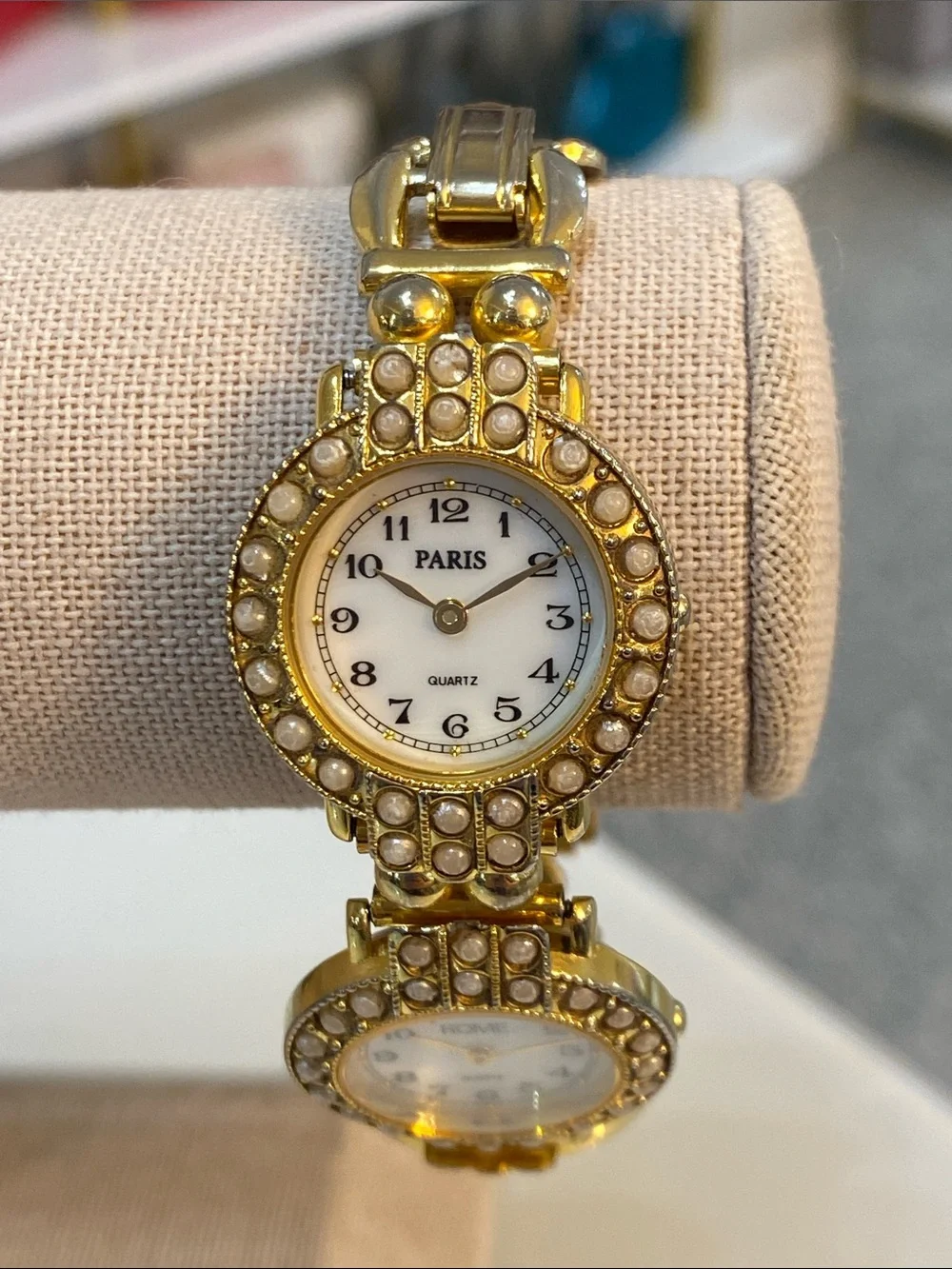 Faux pearl gold tone watch